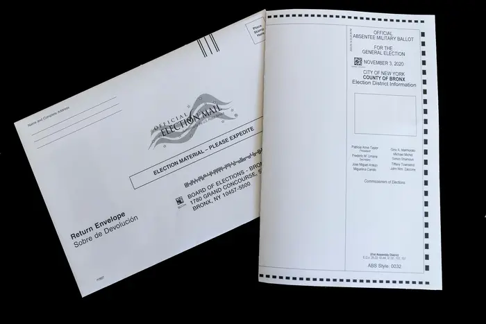 This photo illustration shows an absentee mail in ballot for the 2020 general election sent by the Board of Election in The Bronx.